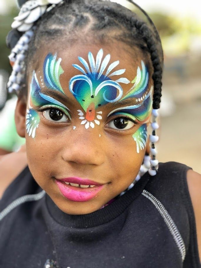 Blue peacock face painting