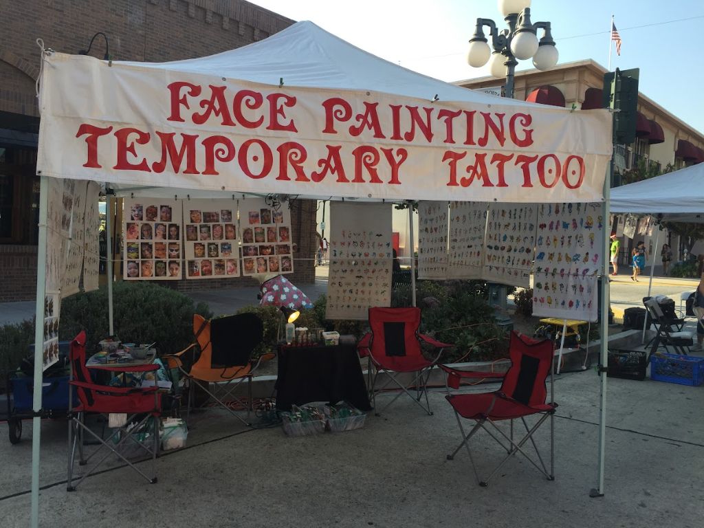 Professional face painting setup at a Los Angeles party event by Bilyana